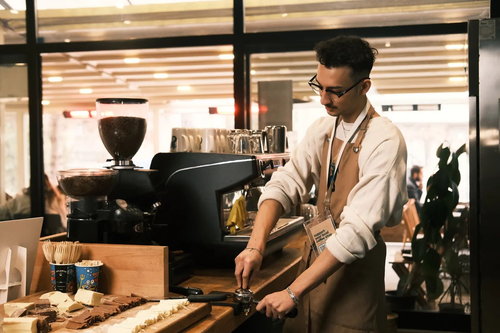 Barista pouring espresso at the coffee bar